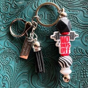 Key Chain “No Days Off” Focal , Black Tassel Silicone Beads, Strength Charm
